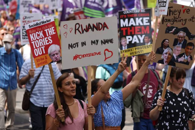 Demonstrators hold placards during the British Trades Union Congress (TUC) ‘We Demand Better’ rally (Photo: Hollie Adams/Getty Images)