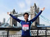 Dame Kelly Holmes poses in front of Tower Bridge ahead of the Virgin Money London Marathon in 2016 (Photo: Alex Broadway/Getty Images)