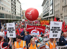 Thousands of protesters march through central London to demand better pay and working conditions over the weekend (Photo: Getty Images)