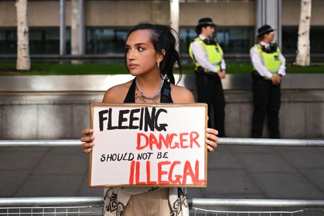 People protest against the UK deportation flights to Rwanda outside the Home Office on June 13, 2022 in London, England (Photo by Leon Neal/Getty Images)