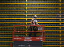 A technician inspects the backside of bitcoin mining at Bitfarms in Quebec (Photo: LARS HAGBERG/AFP via Getty Images)