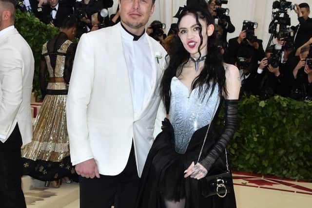 Elon Musk and Grimes arrive for the 2018 Met Gala on May 7, 2018, at the Metropolitan Museum of Art in New York (Photo by ANGELA WEISS/AFP via Getty Images)