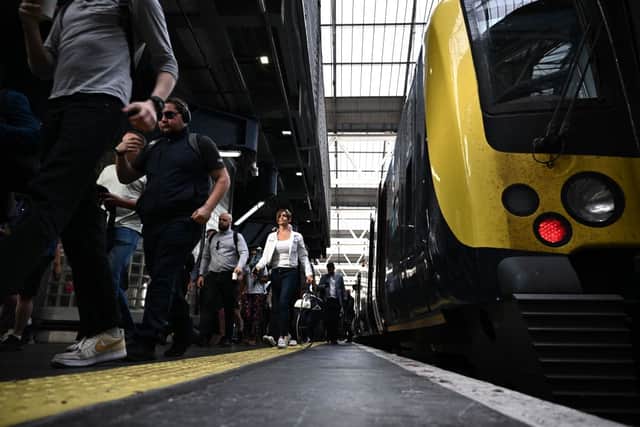 Passengers disembark a train as the biggest rail strike in over 30 years hits the UK (Photo: BEN STANSALL/AFP via Getty Images)