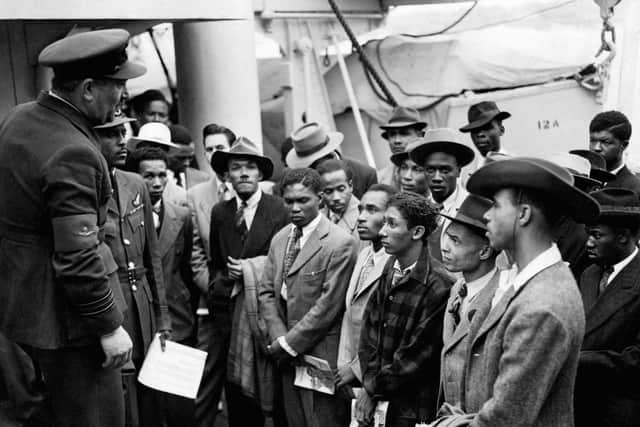 File photo dated 22/06/48 of Jamaican immigrants welcomed by RAF officials from the Colonial Office after the ex-troopship HMT Empire Windrush landed them at Tilbury (Photo: PA)