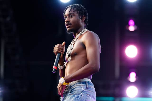 <p>Lil Tjay performs on stage during Rolling Loud at Hard Rock Stadium on July 25, 2021 in Miami Gardens, Florida. (Photo by Rich Fury/Getty Images)</p>