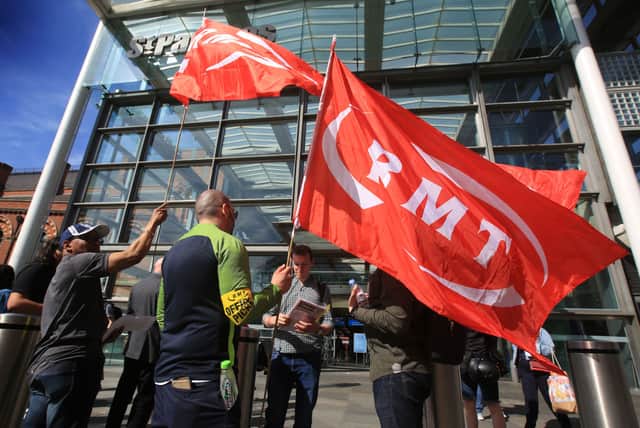 RMT flags fly at the official picket outside St Pancras International station (Photo: Martin Pope/Getty Images)