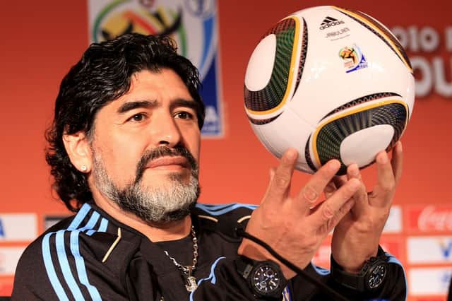 Diego Maradona holds up a match ball  during a press conference in Pretoria, South Africa (Pic: Getty Images)