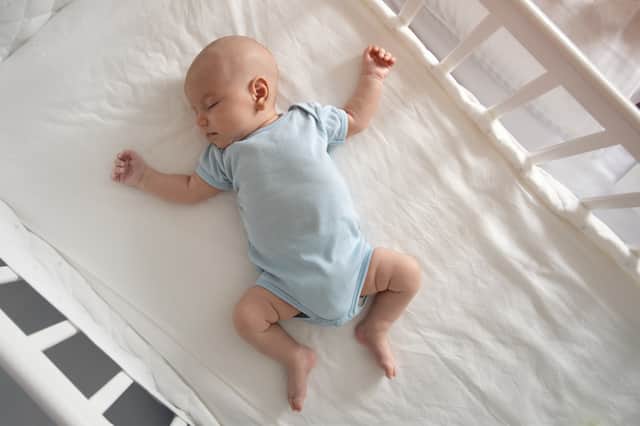Guidance recommends putting babies to sleep on their back without any “soft goods”, such as blankets and toys (Photo: Adobe)