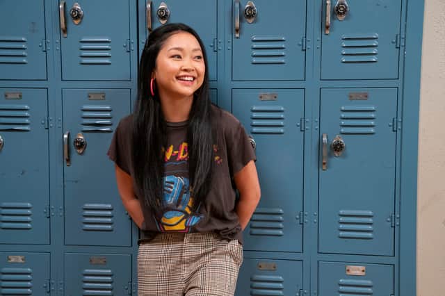 Lana Condor as Erika, leaning against some blue school lockers in Boo, Bitch (Credit: Eric Voake/Netflix)