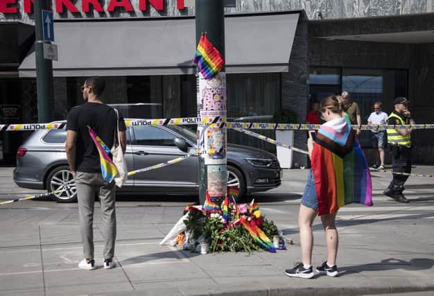 Flowers left at the scene of the Oslo shooting