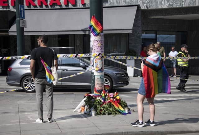 <p>Flowers left at the scene of the Oslo shooting</p>