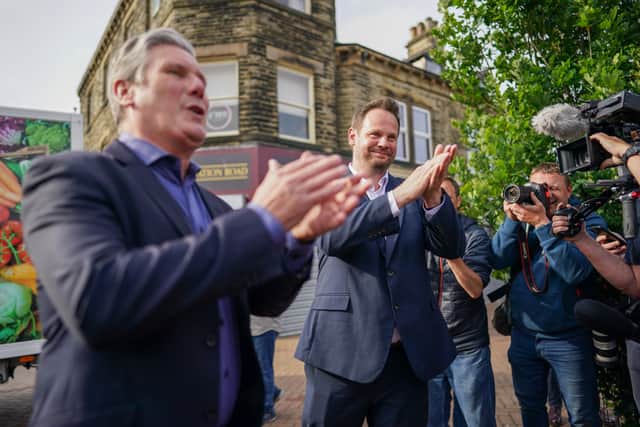 Labour leader Keir Starmer and MP Simon Lightwood celebrate their by-election  win on 24 June
