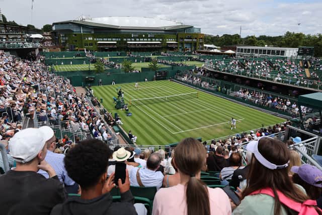 People watch a game on court 2 on the first day of the 2022 Wimbledon Championships (Pic: AFP via Getty Images)