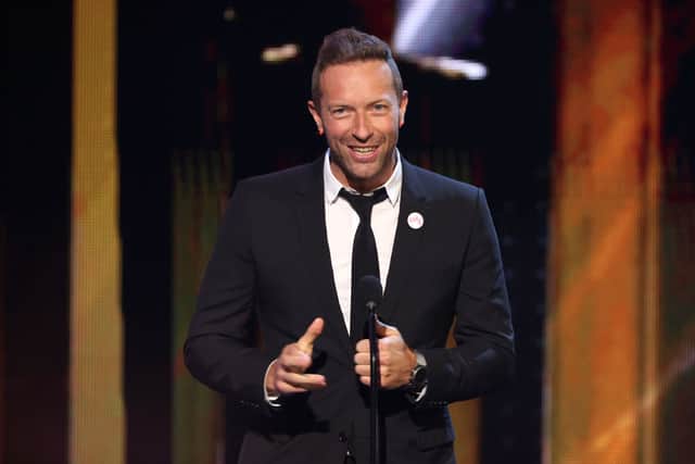 Chris Martin speaks onstage at the 2021 iHeartRadio Music Awards at The Dolby Theatre in Los Angeles, California (Photo by Kevin Winter/Getty Images for iHeartMedia)