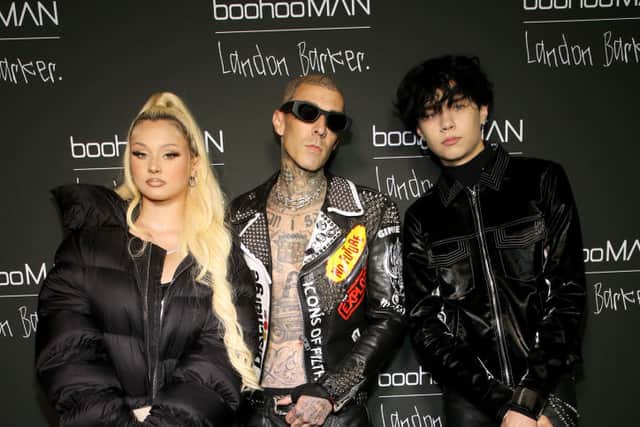 Travis Barker and his children Alabama Barker and Landon Barker at the boohooMAN x Landon Barker launch party at Desert 5 Spot on June 14, 2022 in Los Angeles, California. (Photo by Phillip Faraone/Getty Images for boohooMAN)