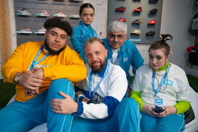 Big Zuu as Mulenga, Francesca Mills as Jemma, Hugo Chegwin as Russell, Mark Silcox as Edgars, and Lucia Keskin as Amber, all wearing turquoise Sports Depot uniforms (Credit: Jack Barnes/UKTV)