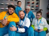 Big Zuu as Mulenga, Francesca Mills as Jemma, Hugo Chegwin as Russell, Mark Silcox as Edgars, and Lucia Keskin as Amber, all wearing turquoise Sports Depot uniforms (Credit: Jack Barnes/UKTV)
