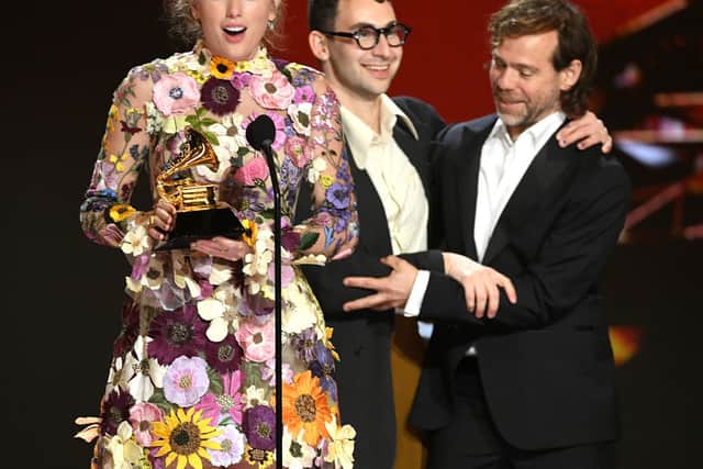 Taylor Swift, Jack Antonoff, and Aaron Dessner accept the Album of the Year award for âFolklore onstage during the 63rd Annual GRAMMY Awards at Los Angeles Convention Center on March 14, 2021 in Los Angeles, California. (Photo by Kevin Winter/Getty Images for The Recording Academy)