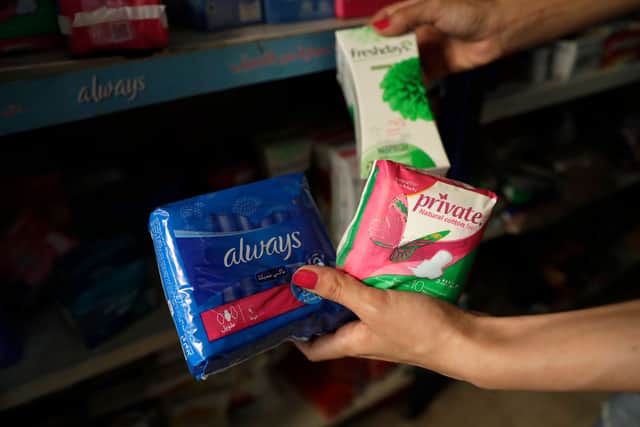 Woman holding sanitary towels (Getty Images)