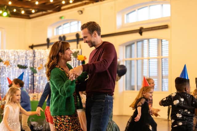 Esther Smith as Nikki and Rafe Spall as Jason, dancing together at a children’s party in Trying season 3 (Credit: Apple TV+)