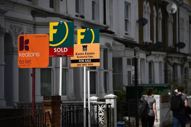 Estate and rental agents’ boards pictured on a residential street in Hackney, east London  (Photo by DANIEL LEAL/AFP via Getty Images)