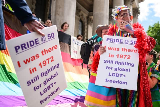 Gay rights activists listen as speeches are made during an event to mark fifty years since the first UK Pride March at Trafalgar Square on July 01, 2022 in London, England (Photo by Leon Neal/Getty Images)