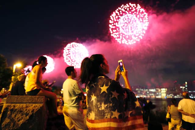 People watch the Macy's 4th of July fireworks show from Queens, New York on July 4, 2017. / AFP PHOTO / EDUARDO MUNOZ ALVAREZ        (Photo credit should read EDUARDO MUNOZ ALVAREZ/AFP via Getty Images)