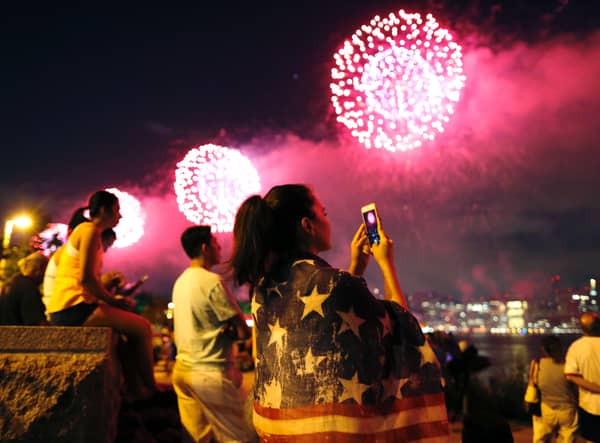 People watch the Macy's 4th of July fireworks show from Queens, New York on July 4, 2017. / AFP PHOTO / EDUARDO MUNOZ ALVAREZ        (Photo credit should read EDUARDO MUNOZ ALVAREZ/AFP via Getty Images)