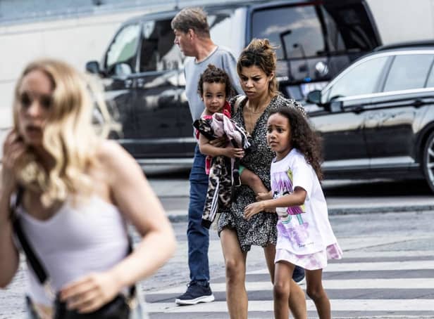 <p>People leave the Fields shopping mall, where a gunman killed three people and wounded several others in Copenhagen on 3 July 2022 (Photo: OLAFUR STEINAR GESTSSON/Ritzau Scanpix/AFP via Getty Images)</p>