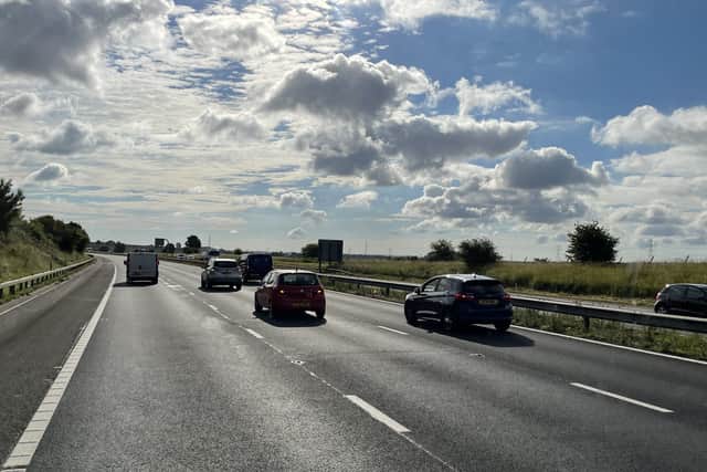 Vehicles on a near-empty M4 motorway, as seen from the cab of a vehicle taking part in a go-slow protest