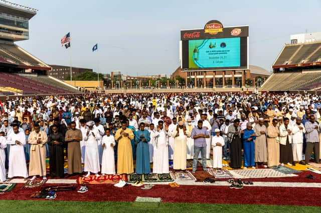 Muslim worshippers gather at the Huntington Bank Stadium during Eid al-Adha prayers and festivities on July 20, 2021 in Minneapolis, Minnesota
