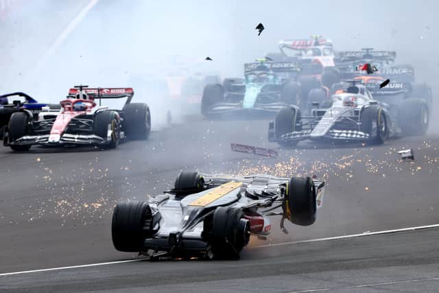 Zhou Guanyu of China crashes at the start of the British Grand Prix (Getty Images)