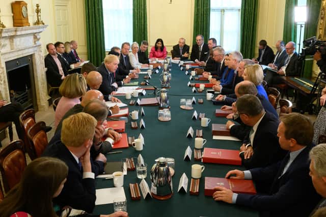 The position of chief whip is a Cabinet role, with serving chief whip Chris Heaton-Harris pictured at the head of table in a recent meeting of Boris Johnson’s top team (image: Getty Images)