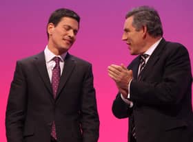 Gordon Brown congratulates then-foreign secretary David Miliband after his address to the Labour Party Conference in the Brighton Centre on October 1, 2009 