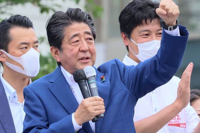 Former Japanese Prime Minister Shinzo Abe delivering a campaign speech for the ruling Liberal Democratic Party (Photo by YOSHIKAZU TSUNO/AFP via Getty Images)