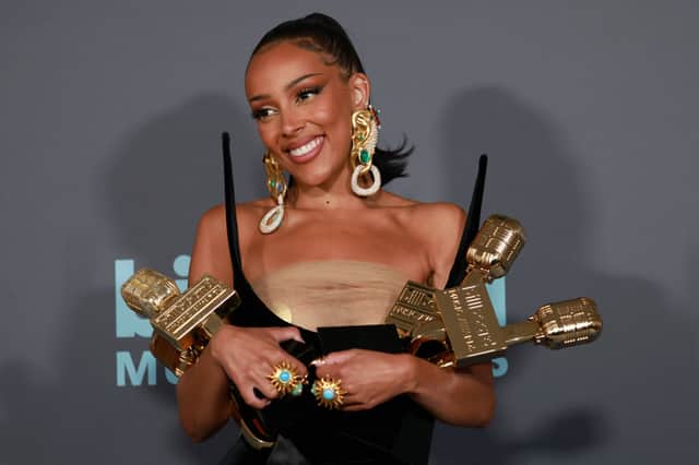 Doja Cat poses backstage with awards for the Top R&B Album, Top R&B Female Artist, Top R&B Artist and Top Viral Song during the 2022 Billboard Music Awards at MGM Grand Garden Arena on May 15, 2022 in Las Vegas, Nevada. (Photo by Frazer Harrison/Getty Images for MRC)
