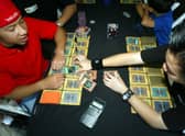 Young players compete in a game of Yu-Gi-Oh! at the Chinese Theater August 7, 2004 in Los Angeles, California.  (Photo by Kevin Winter/Getty Images)