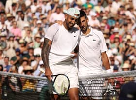 Djokovic and Kyrgios embrace after an intense battle on centre court