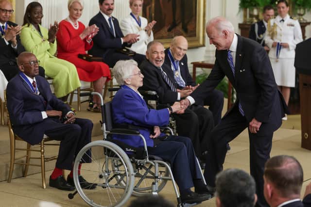 President Biden presents the Presidential Medal of Freedom to Wilma Vaught, one of the most decorated women in U.S military history.(Getty Images)