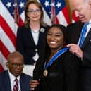 US president Joe Biden presents Gymnast Simone Biles with the Presidential Medal of Freedom. (Getty Images) 