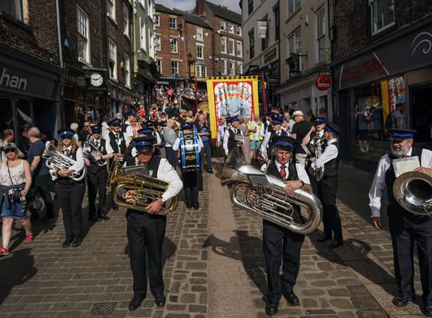  Musicians from colliery bands perform as they march through the city during the 136th Durham Miners Gala on July 09, 2022 in Durham, England