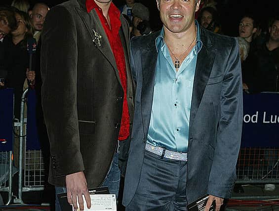 Graham Norton (R) and Kristian Seeber arrive at the 10th Anniversary National Television Awards at the Royal Albert Hall on October 26, 2004 in London (Photo by Jo Hale/Getty Images)