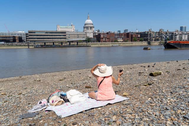 A woman enjoying the warm weather in London. Photo: Getty