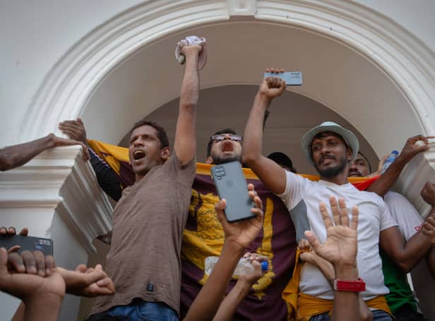 <p> Protestors shout slogans after taking control of the Prime Minister’s office compound during a protest (Photo: Abhishek Chinnappa/Getty Images)</p>