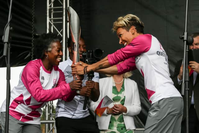 Dame Kelly Holmes takes the Queen’s Baton in Tonbridge on 7 July 2022