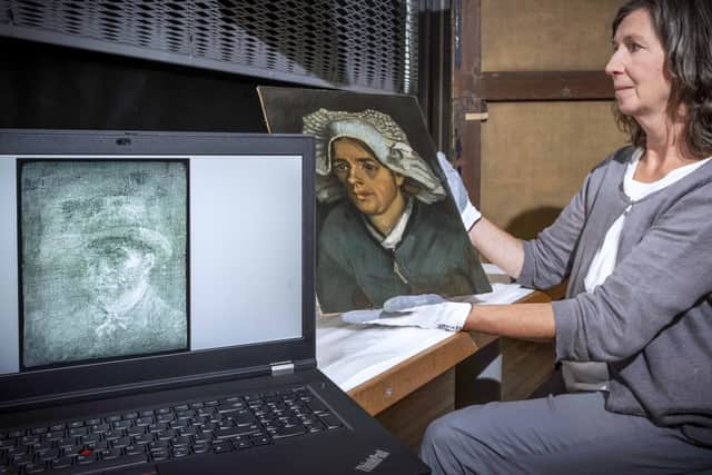 Senior Conservator Lesley Stevenson views Head of a Peasant Woman alongside an x-ray image of the hidden Van Gogh self-portrait (Photo: PA/Neil Hannah)
