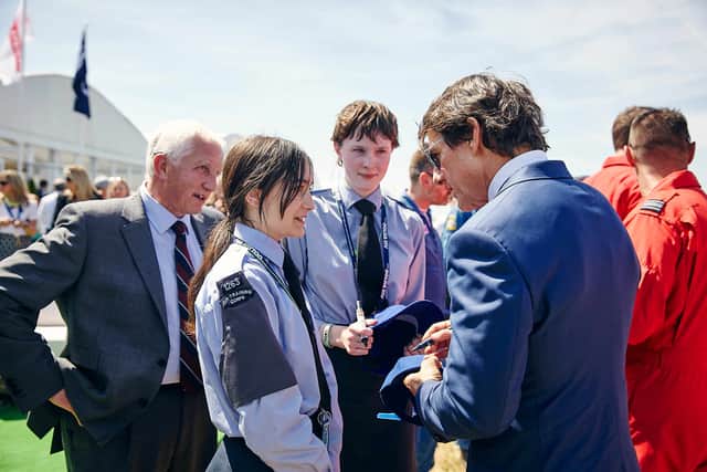 Tom Cruise (right) speaking to RAF Air Cadets, at the Royal International Air Tattoo, at RAF Fairford in Gloucestershire. Picture: Royal Air Force Charitable Trust Enterprises (RAFCTE)/ PA