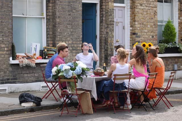 Londoners dine on the street in Hackey, London in a bid to keep cool (Pic: Getty Images)