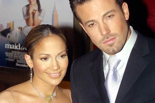 Jennifer Lopez and Ben Affleck arrive at the premiere of Lopez’s new film “Maid in Manhattan” in New York, 08 December 2002. AFP PHOTO/Doug KANTER (Photo credit should read DOUG KANTER/AFP via Getty Images)
