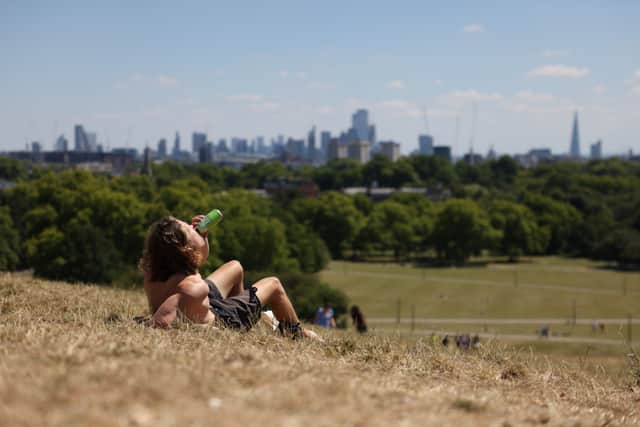 A man drinks a beer on Primrose Hill in London, England (Pic: Getty Images)